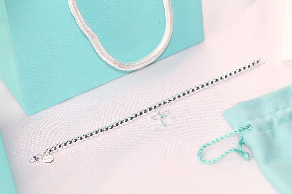 TIFFANY STERLING SILVER BOW BEAD BRACELET