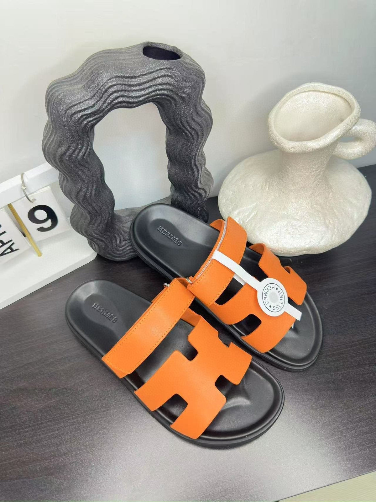 Hermès Orange Interwoven Slide Sandals - Orange and Black