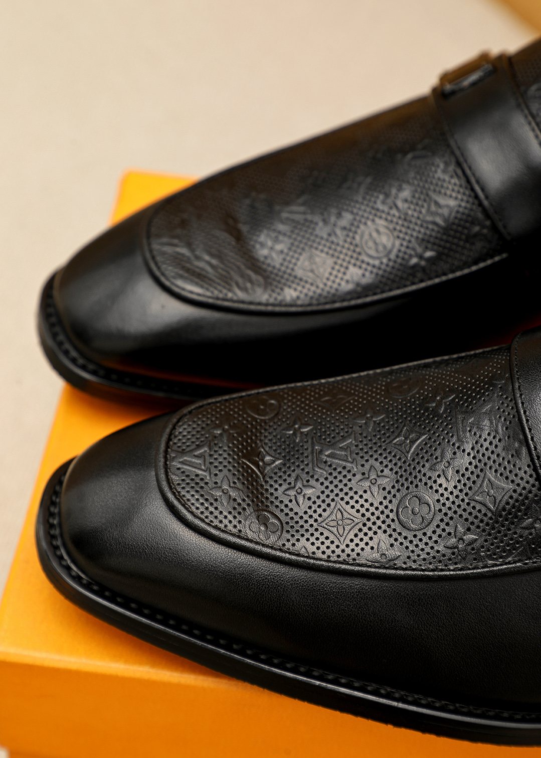 Louis Vuitton Men's Black Embossed Loafers - Rounded Toe